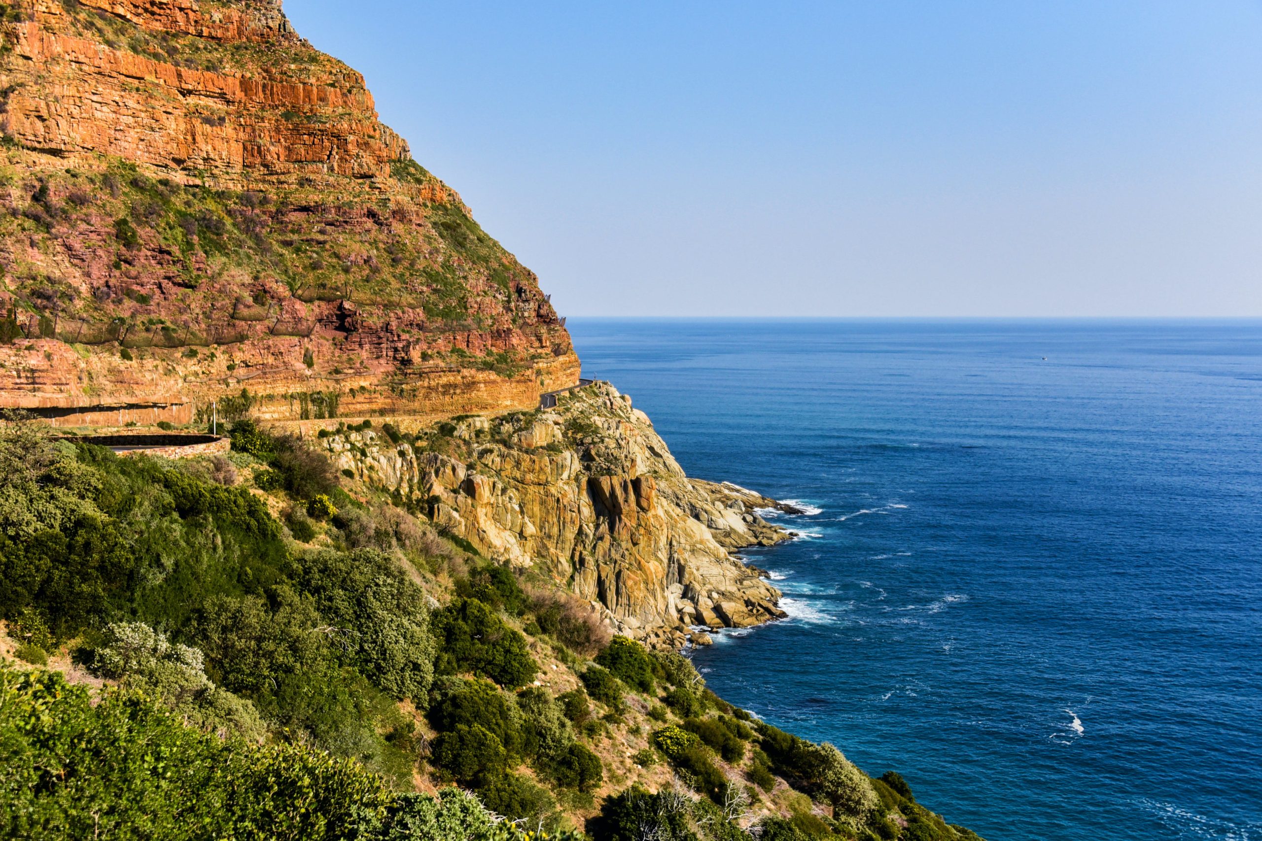 Scenic drive along Chapman's Peak, with winding coastal roads and breathtaking ocean views—showcasing the beauty of our Western Cape tours